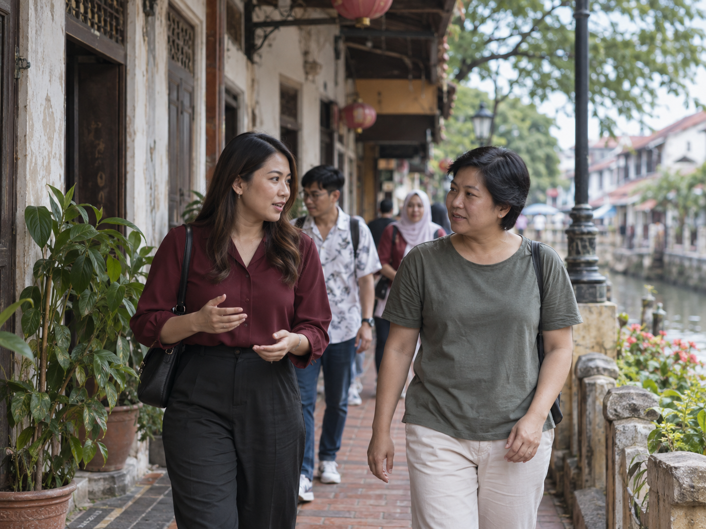An adviser having a natural walking conversation in Melaka.